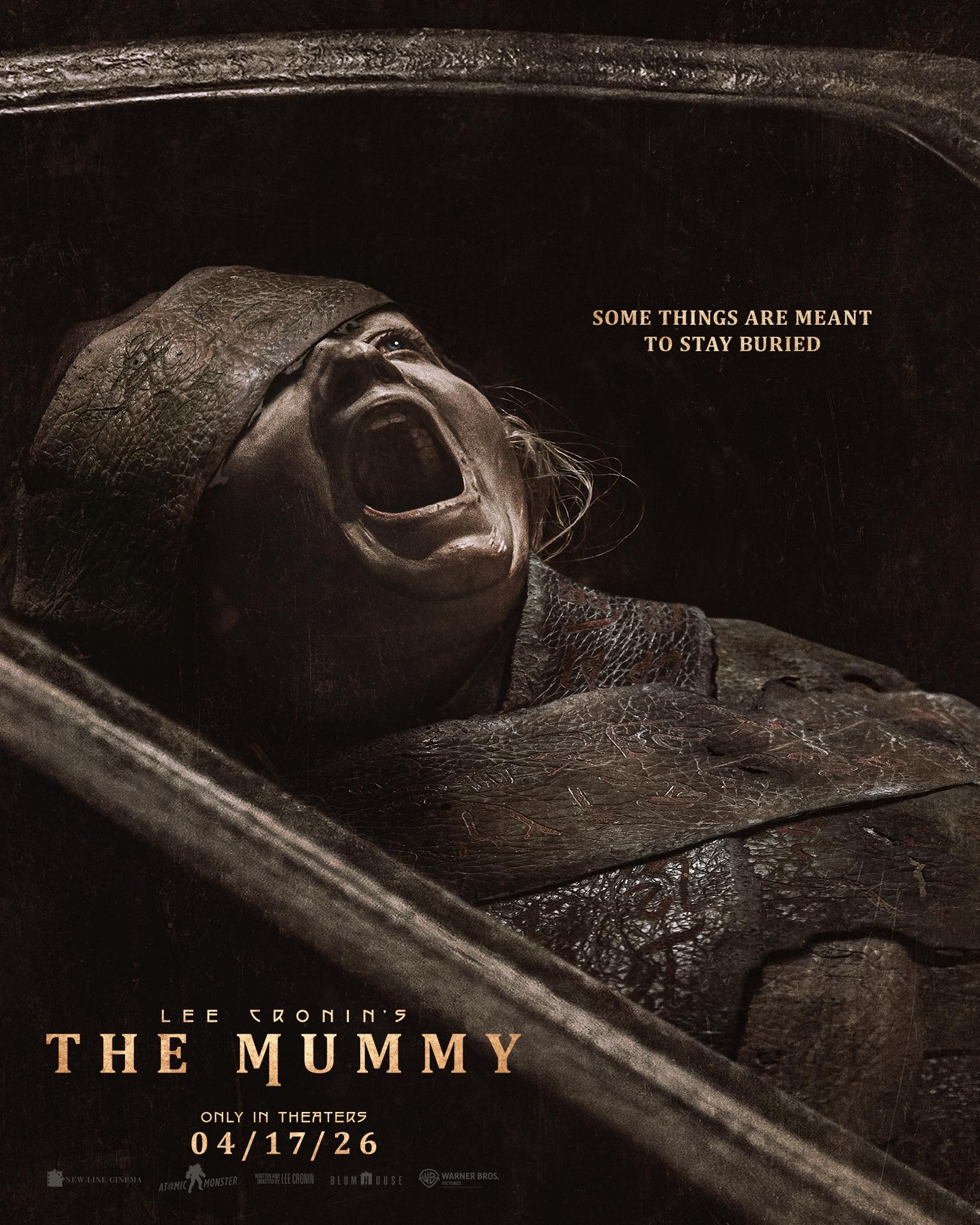 A person is wrapped in mummy cloth. This person is screaming from inside the coffin.
