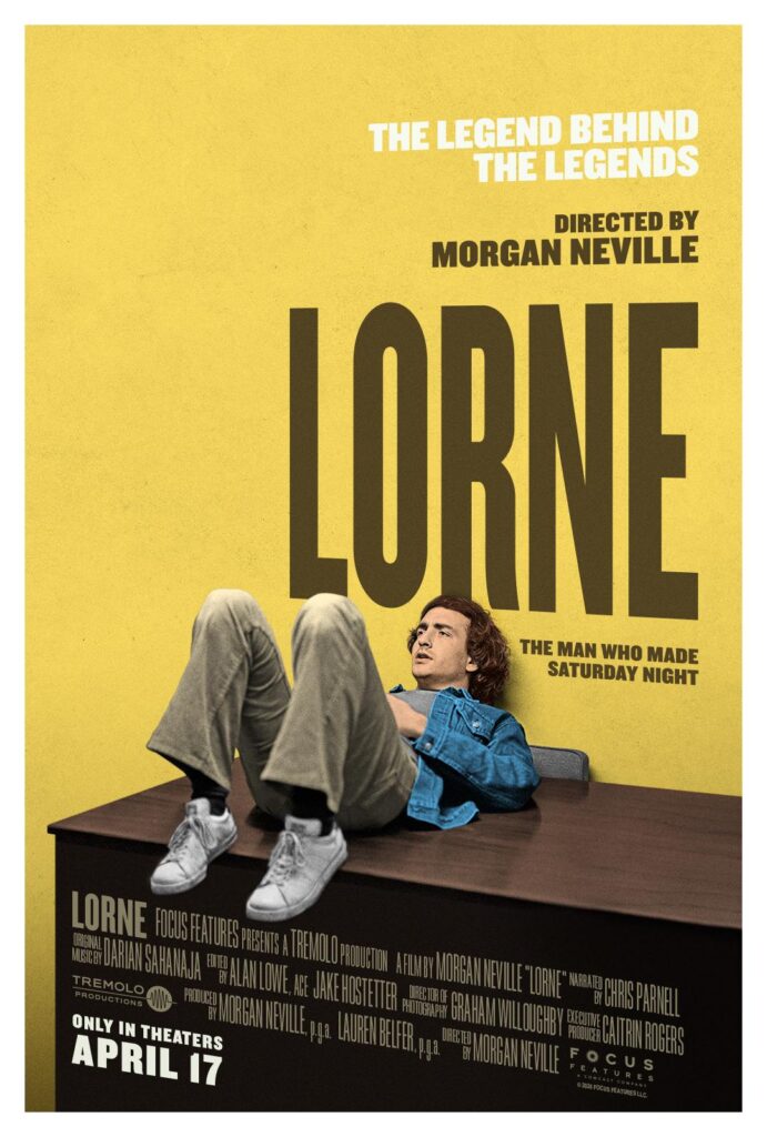 A person is laying down on a table against the yellow wall