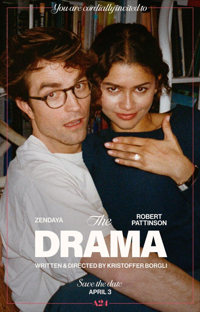 A couple are sitting on one's lap. One of them are flashing an engagement ring.