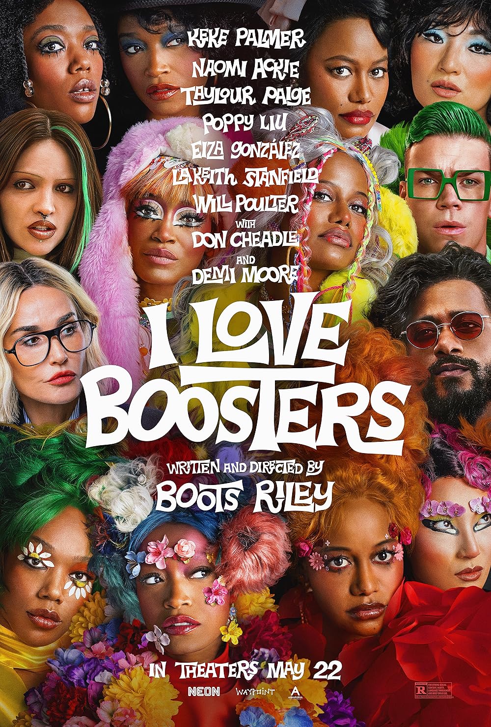 Fifteen actors with colorful wigs and eyelashes looking at the camera.